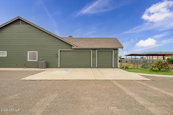 a view of a livingroom with wooden floor and a fireplace
