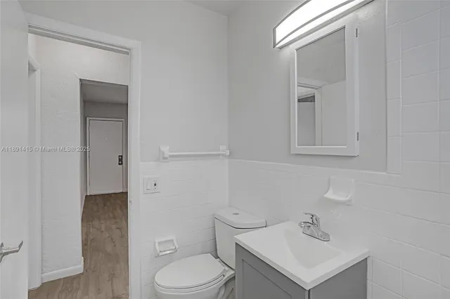 a bathroom with a sink toilet and vanity
