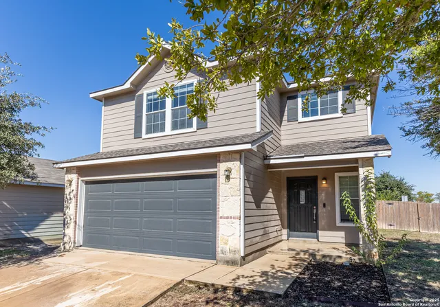 a front view of a house with a garage