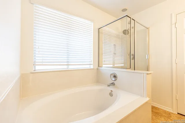 a white bath tub sitting next to a window