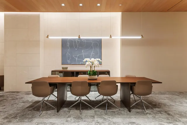 a room with furniture pool table and windows