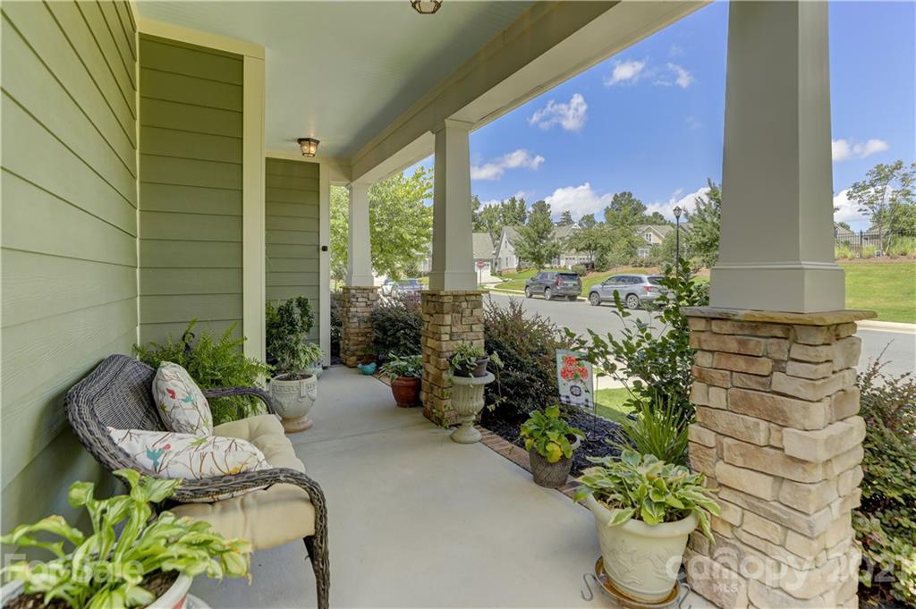 2016 Henslow Trail Tega Cay, SC 29708 - Photo 2 of 33 a view of a porch with chairs and potted plants