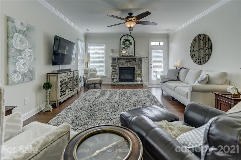 2016 Henslow Trail Tega Cay, SC 29708 - Photo 13 of 33 a living room with furniture a fireplace and a flat screen tv