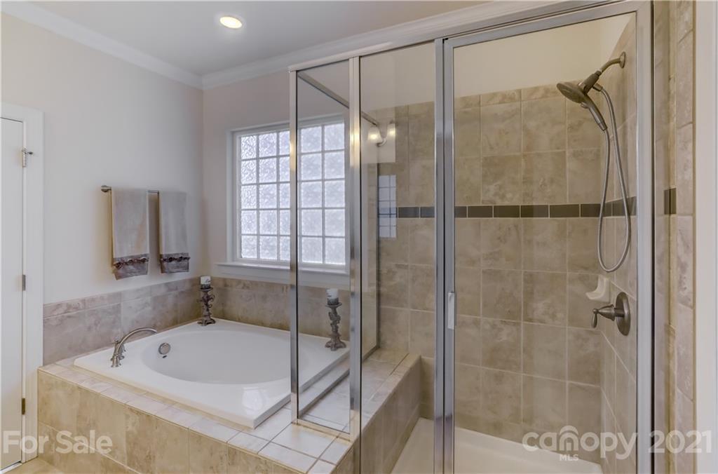 2016 Henslow Trail Tega Cay, SC 29708 - Photo 18 of 33 a bathroom with a tub shower and a sink