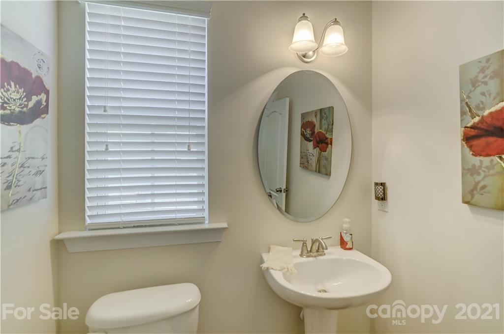 2016 Henslow Trail Tega Cay, SC 29708 - Photo 20 of 33 a bathroom with a sink and a mirror