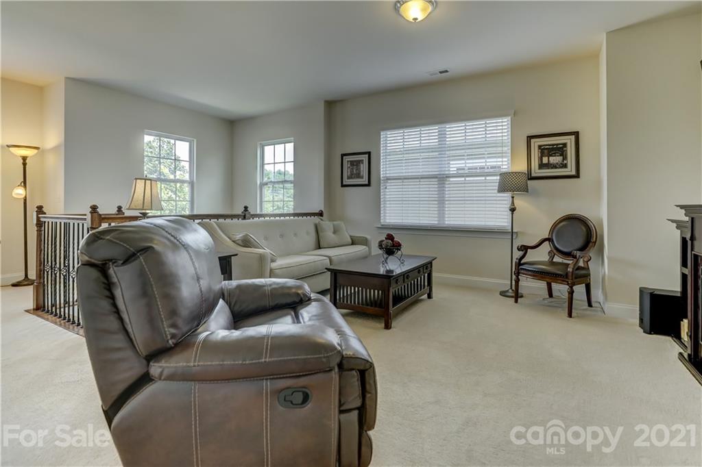 2016 Henslow Trail Tega Cay, SC 29708 - Photo 22 of 33 a living room with furniture and a window