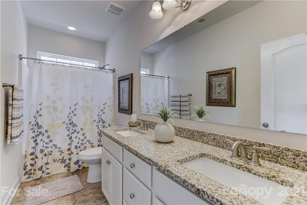 2016 Henslow Trail Tega Cay, SC 29708 - Photo 25 of 33 a bathroom with a granite countertop sink mirror and double