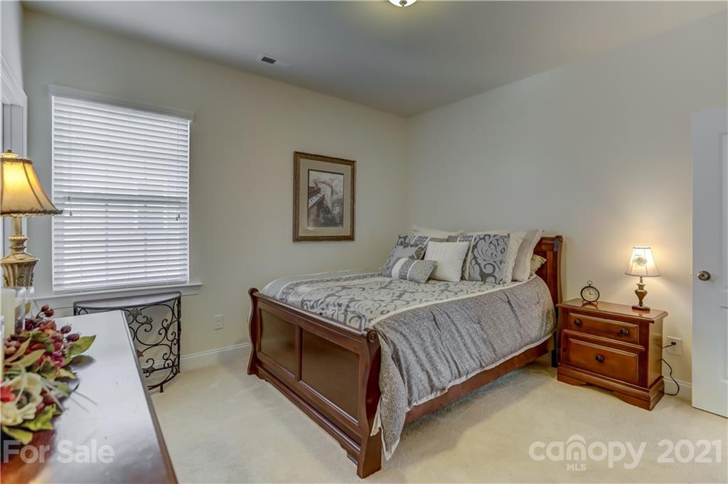 2016 Henslow Trail Tega Cay, SC 29708 - Photo 26 of 33 a bedroom with a bed and a window