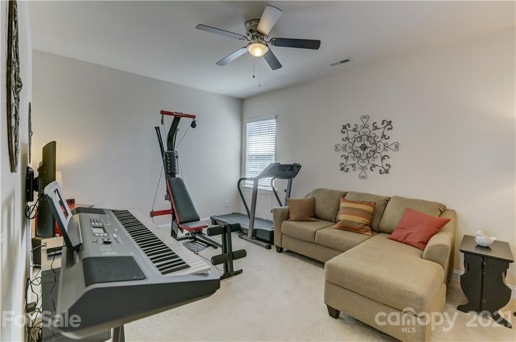 2016 Henslow Trail Tega Cay, SC 29708 - Photo 27 of 33 a living room with furniture a air conditioner and a window