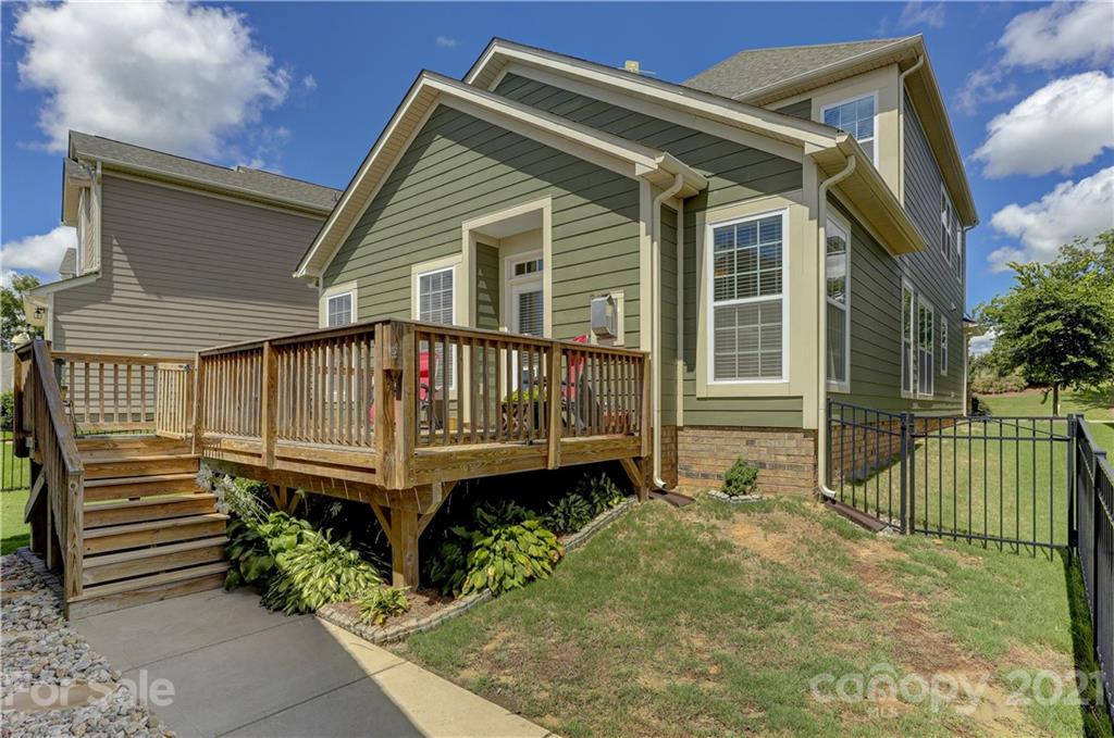 2016 Henslow Trail Tega Cay, SC 29708 - Photo 32 of 33 a view of a house with a small yard and wooden fence