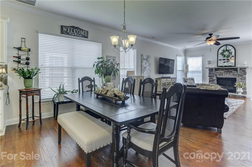 2016 Henslow Trail Tega Cay, SC 29708 - Photo 10 of 33 a view of a dining room with furniture window and wooden floor