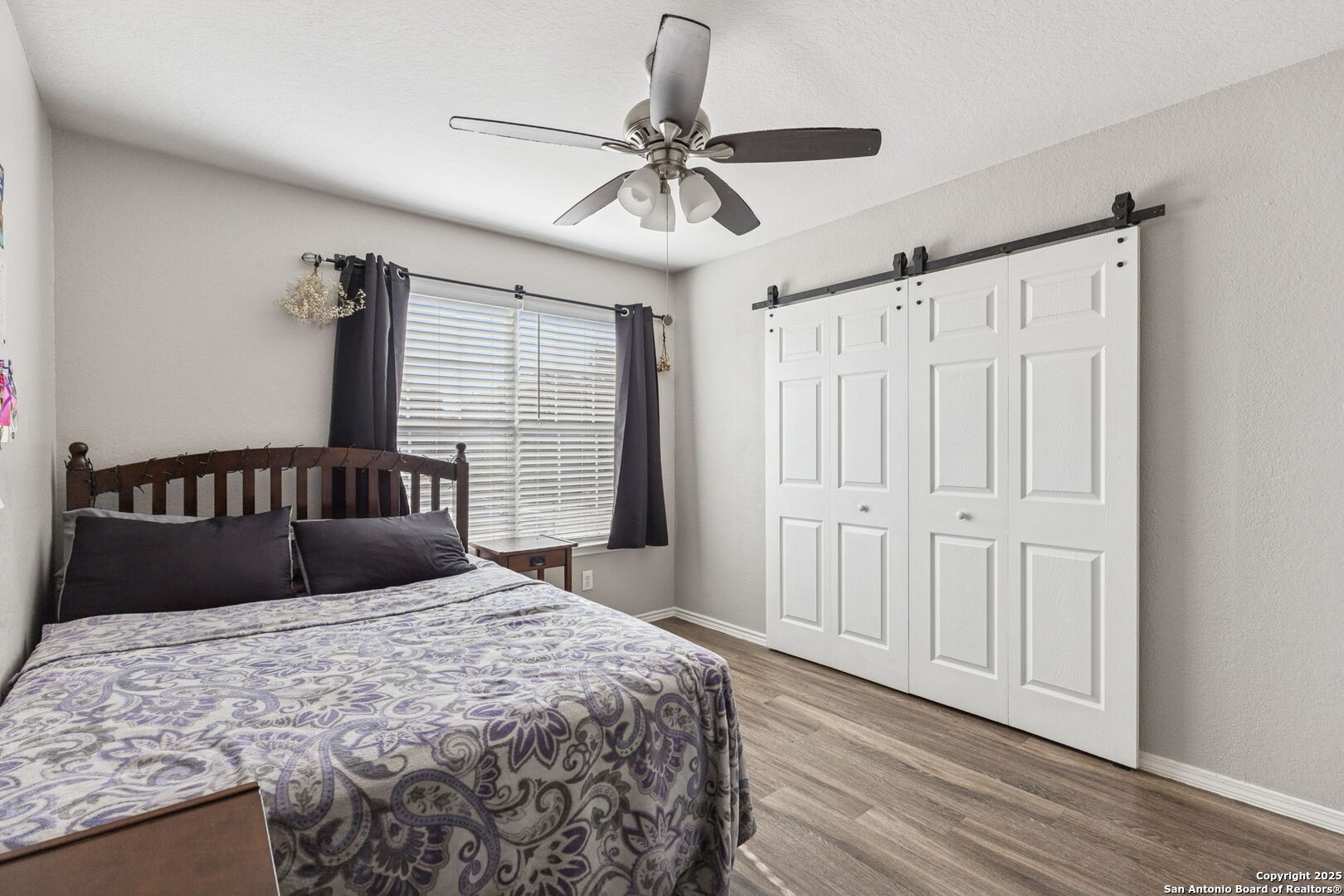 8919 Kestrel Oak Converse, TX 78109 - Photo 18 of 24 a bedroom with a bed and a ceiling fan