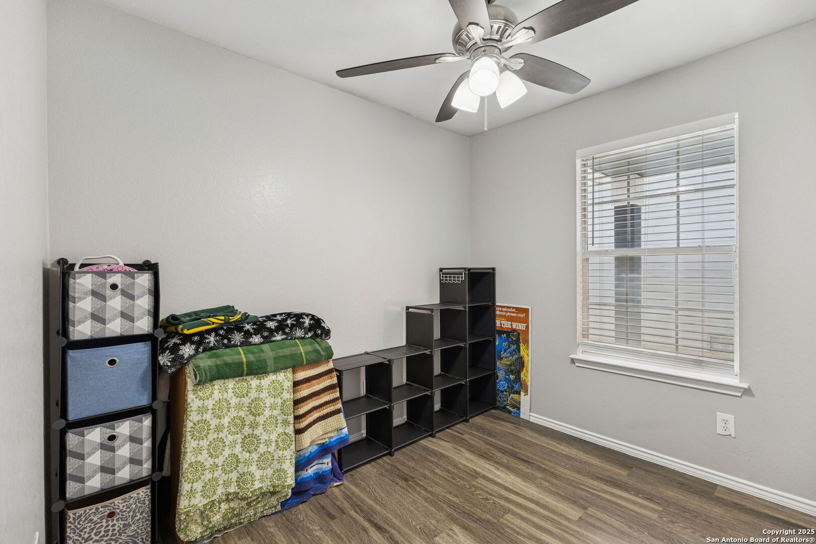 8919 Kestrel Oak Converse, TX 78109 - Photo 19 of 24 a view of a bedroom with workspace and window