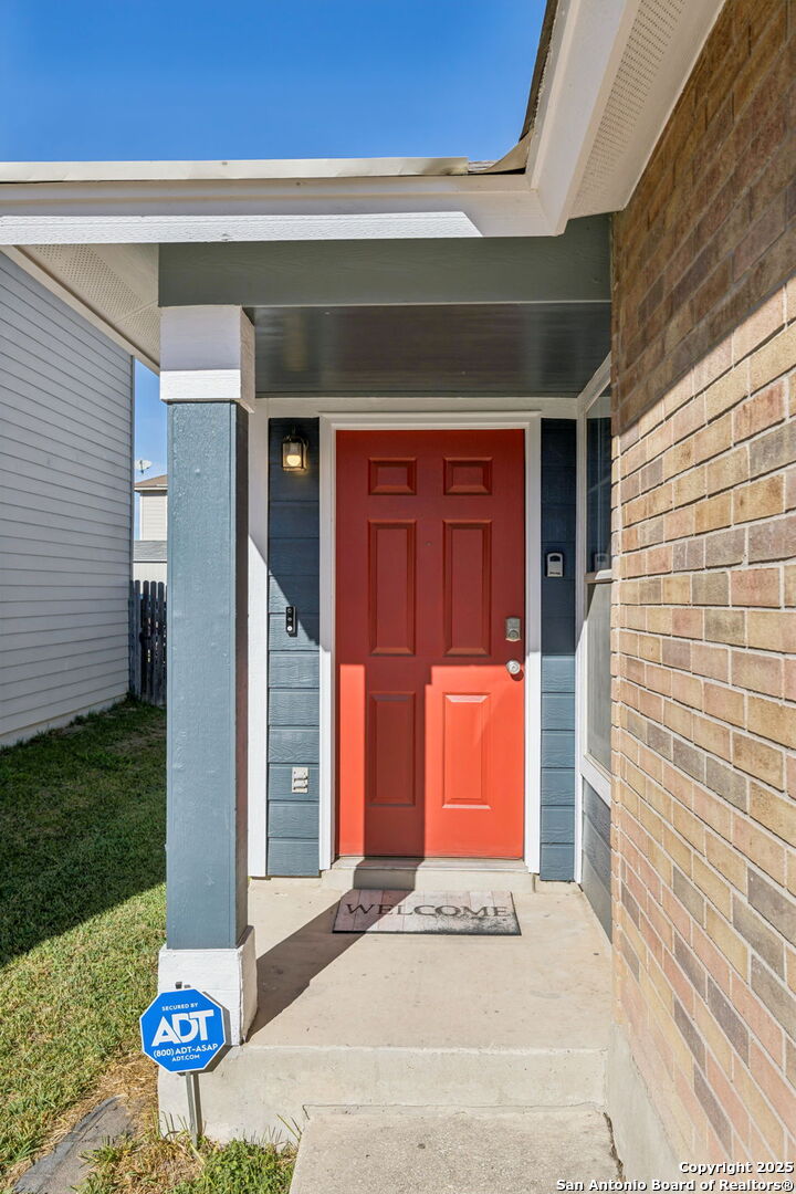8919 Kestrel Oak Converse, TX 78109 - Photo 2 of 24 a front view of a house with umbrella