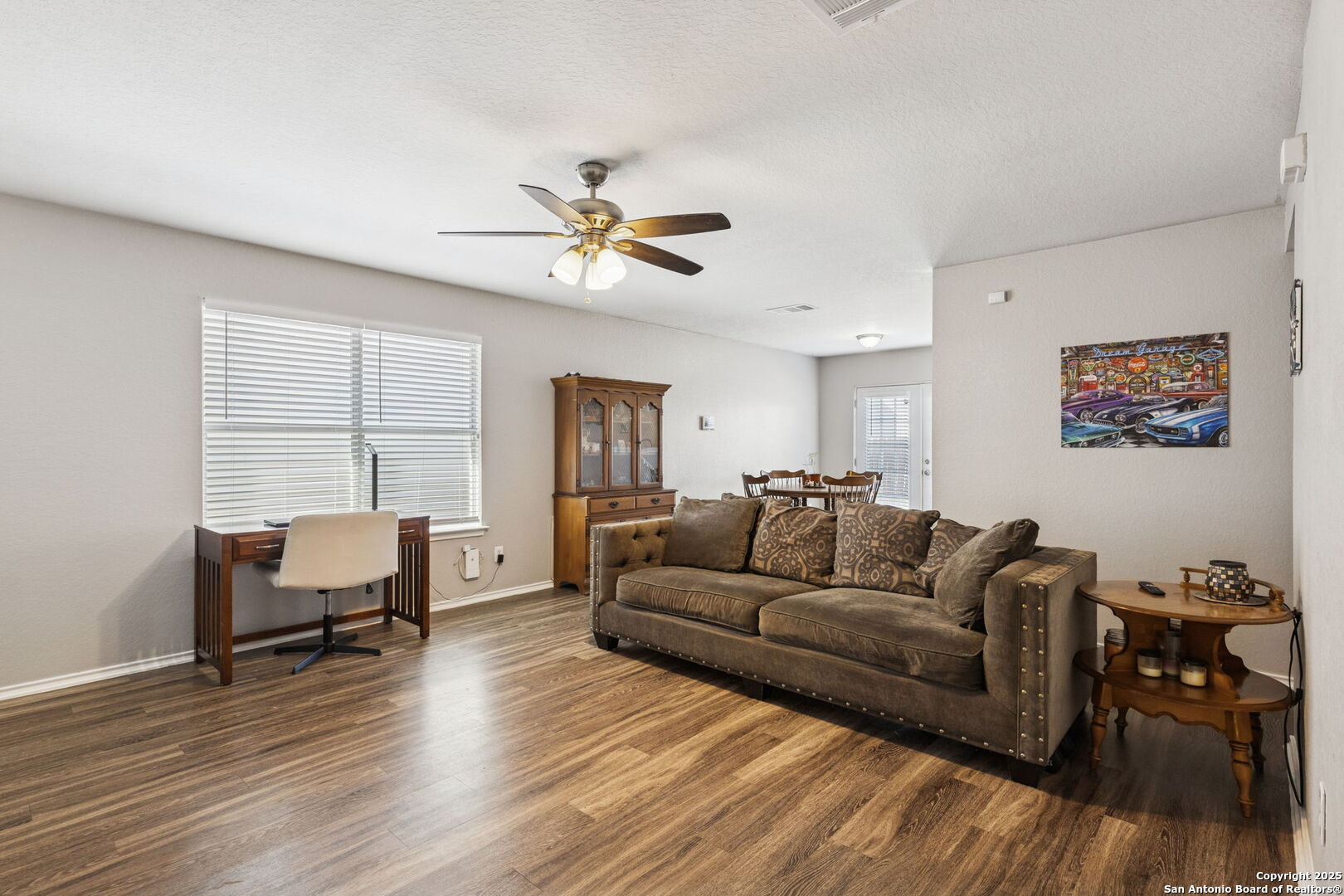 8919 Kestrel Oak Converse, TX 78109 - Photo 23 of 24 a living room with furniture and a wooden floor