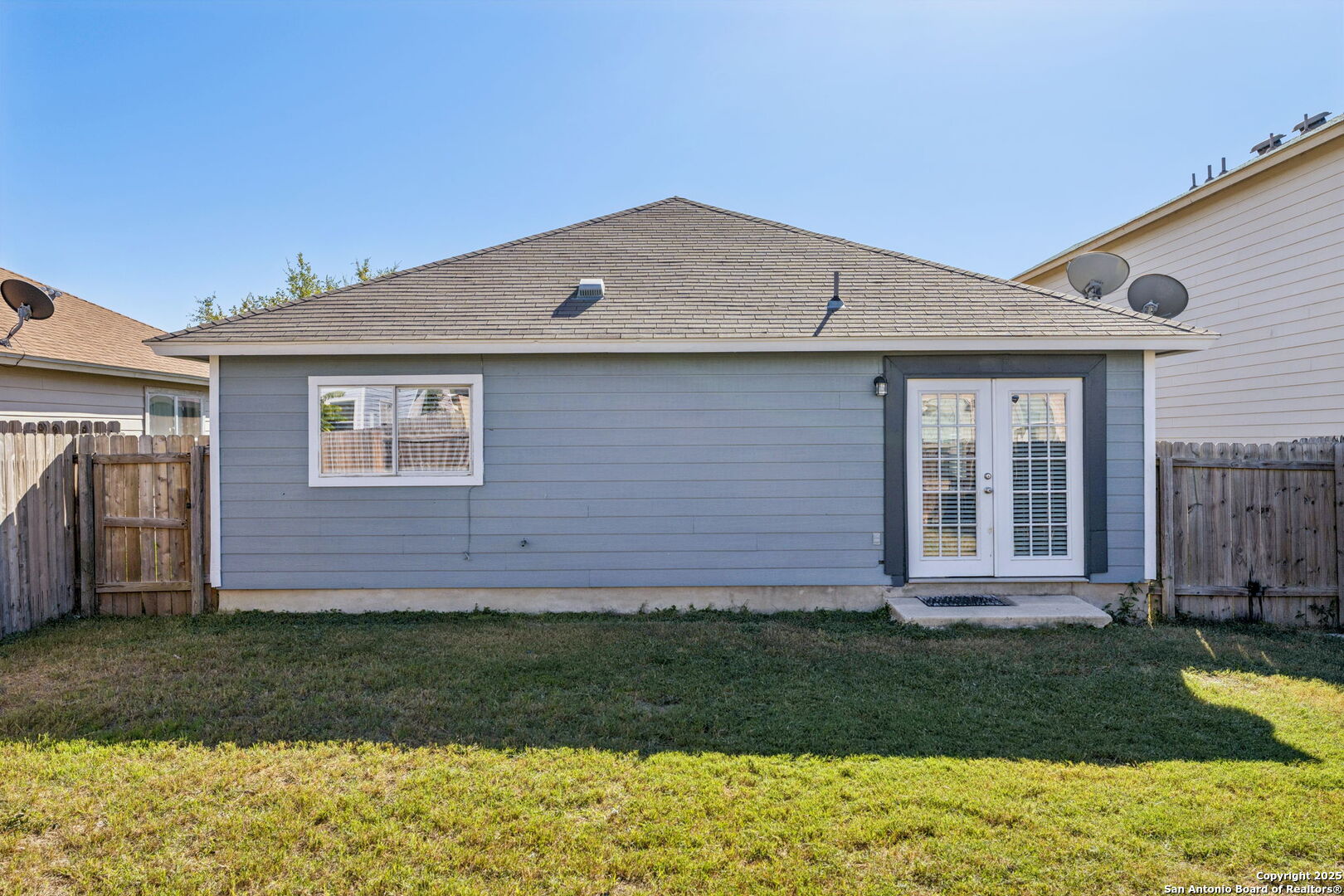 8919 Kestrel Oak Converse, TX 78109 - Photo 5 of 24 a front view of a house with a yard