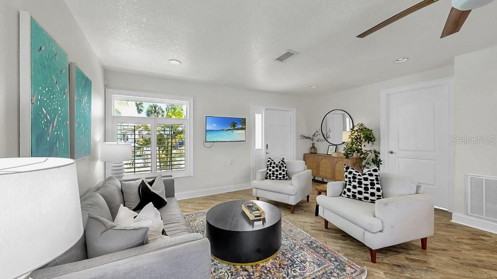 1004 Sago Palm Way Apollo Beach, FL 33572 - Photo 11 of 25 a living room with furniture and a large window