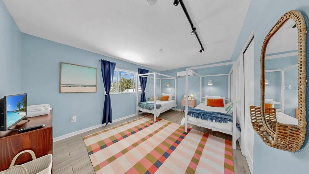 1004 Sago Palm Way Apollo Beach, FL 33572 - Photo 14 of 25 a bedroom with furniture and a rug