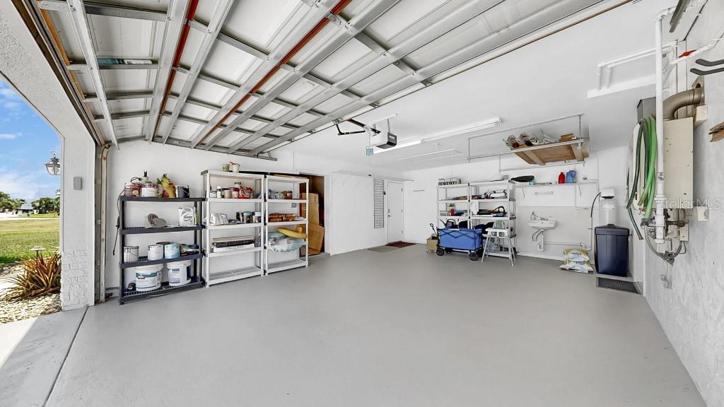 1004 Sago Palm Way Apollo Beach, FL 33572 - Photo 24 of 25 a view of a garage with storage