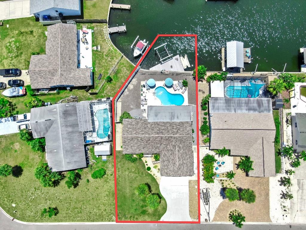 1004 Sago Palm Way Apollo Beach, FL 33572 - Photo 3 of 25 an aerial view of multiple houses with outdoor space