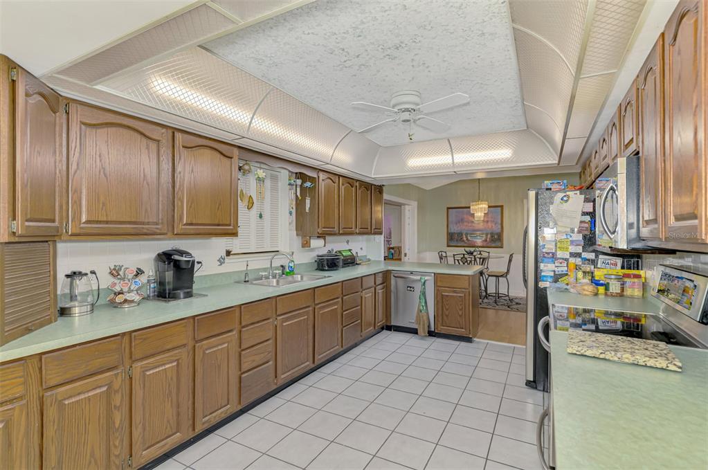 1137 Ponderosa Road Venice, FL 34293 - Photo 21 of 48 a kitchen with a sink cabinets and window