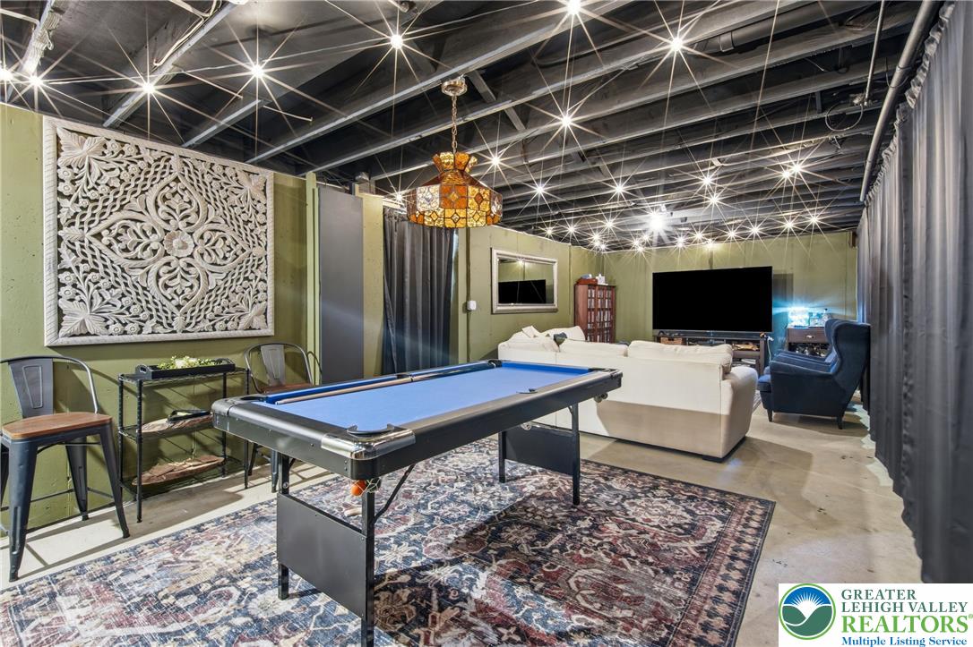 890 Lahr Road Nazareth, PA 18064 - Photo 34 of 71 Entertain guests in this spacious recreation room, featuring a pool table and inviting lounge area.