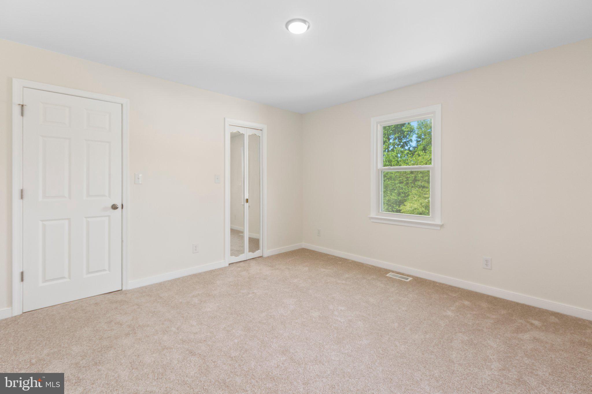 910 Ficklen Road Fredericksburg, VA 22405 - Photo 19 of 45 Walk-in closet door is a mirror