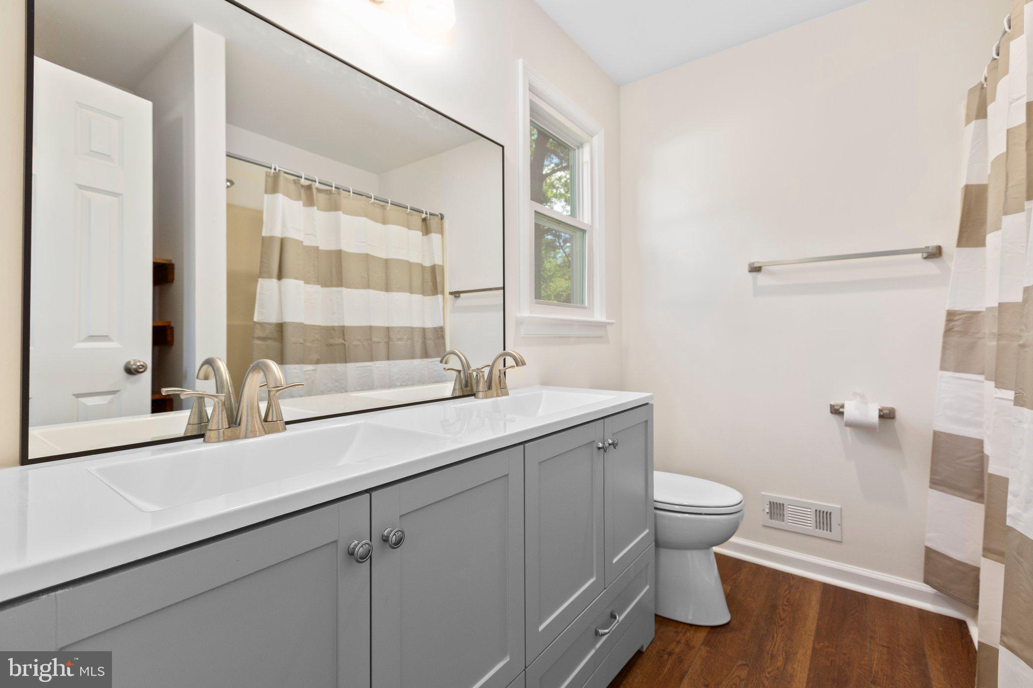 910 Ficklen Road Fredericksburg, VA 22405 - Photo 21 of 45 Ensuite with double vanity, tub/shower
