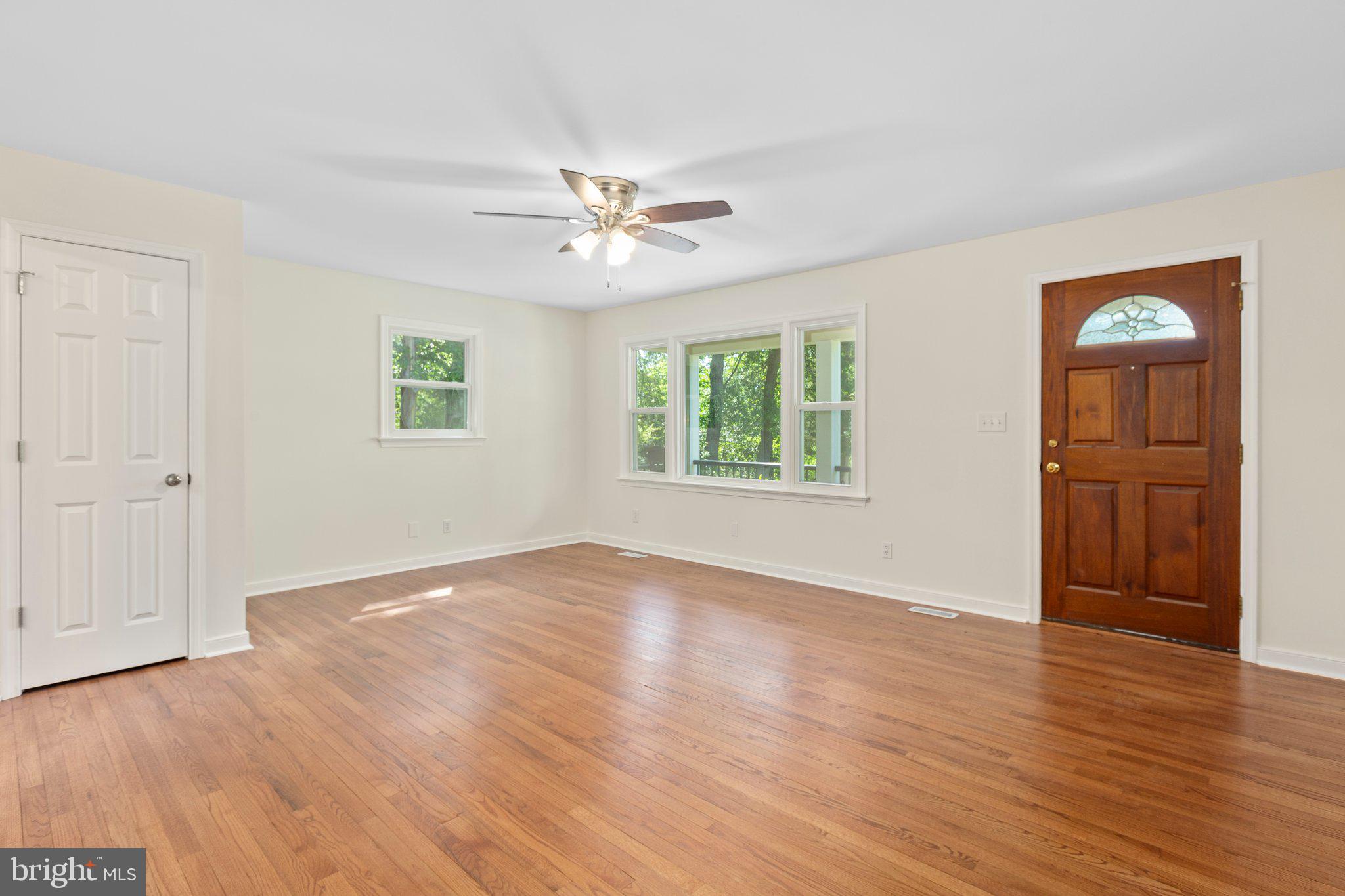 910 Ficklen Road Fredericksburg, VA 22405 - Photo 7 of 45 Refinished hardwood in the family room and hallway