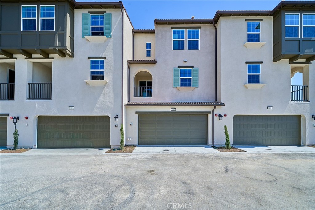a front view of a house with a garage