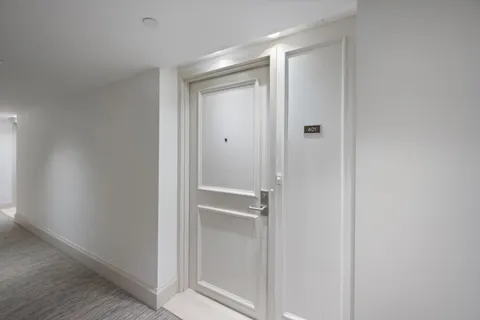 a bathroom with a glass shower door