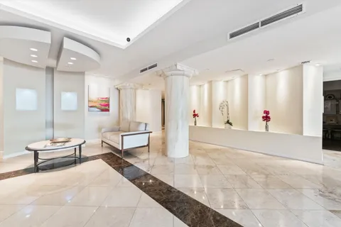 a living room with furniture and white walls