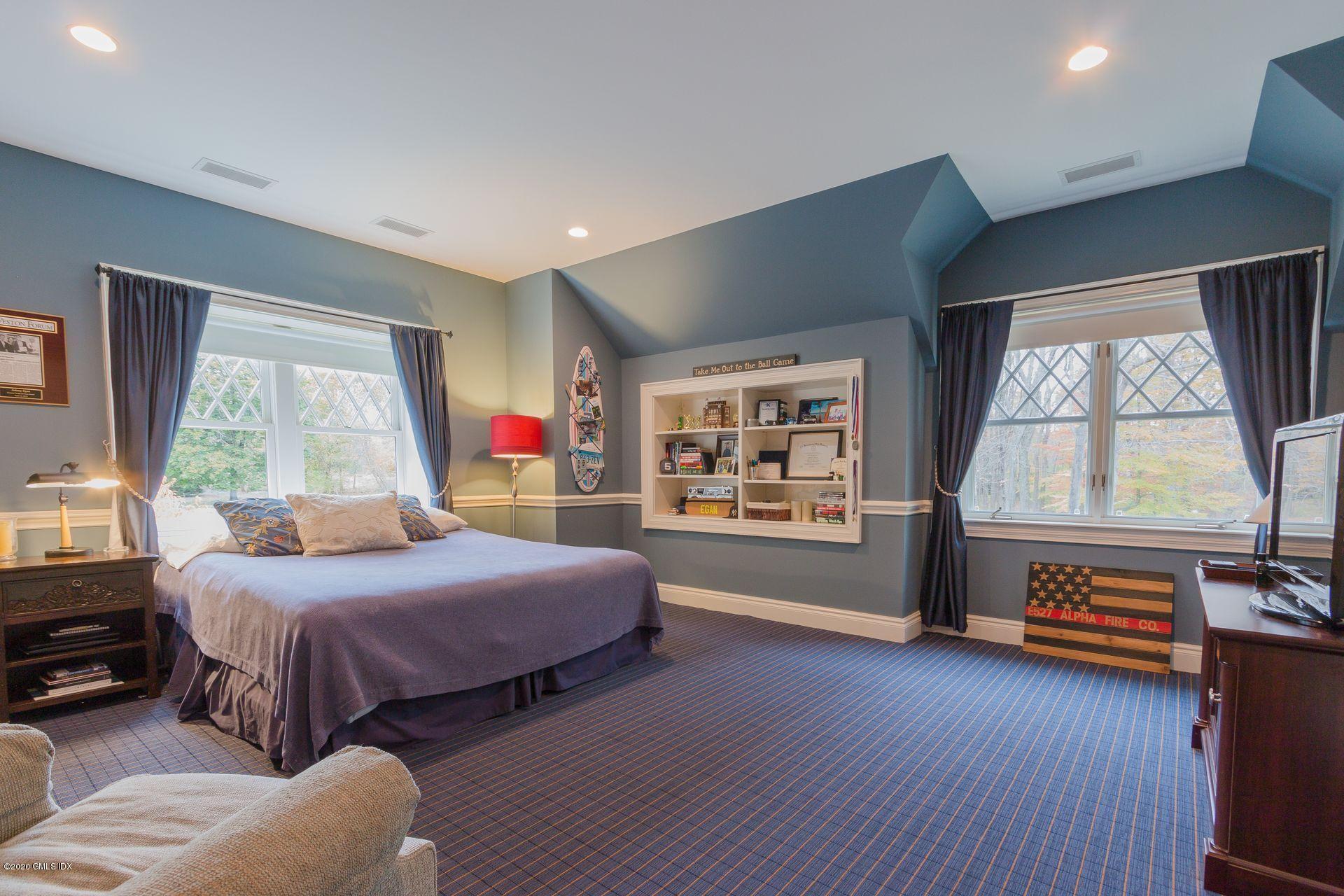 123 Kettle Creek Road Weston, CT 06883 - Photo 11 of 41 a bedroom with a bed and a large window