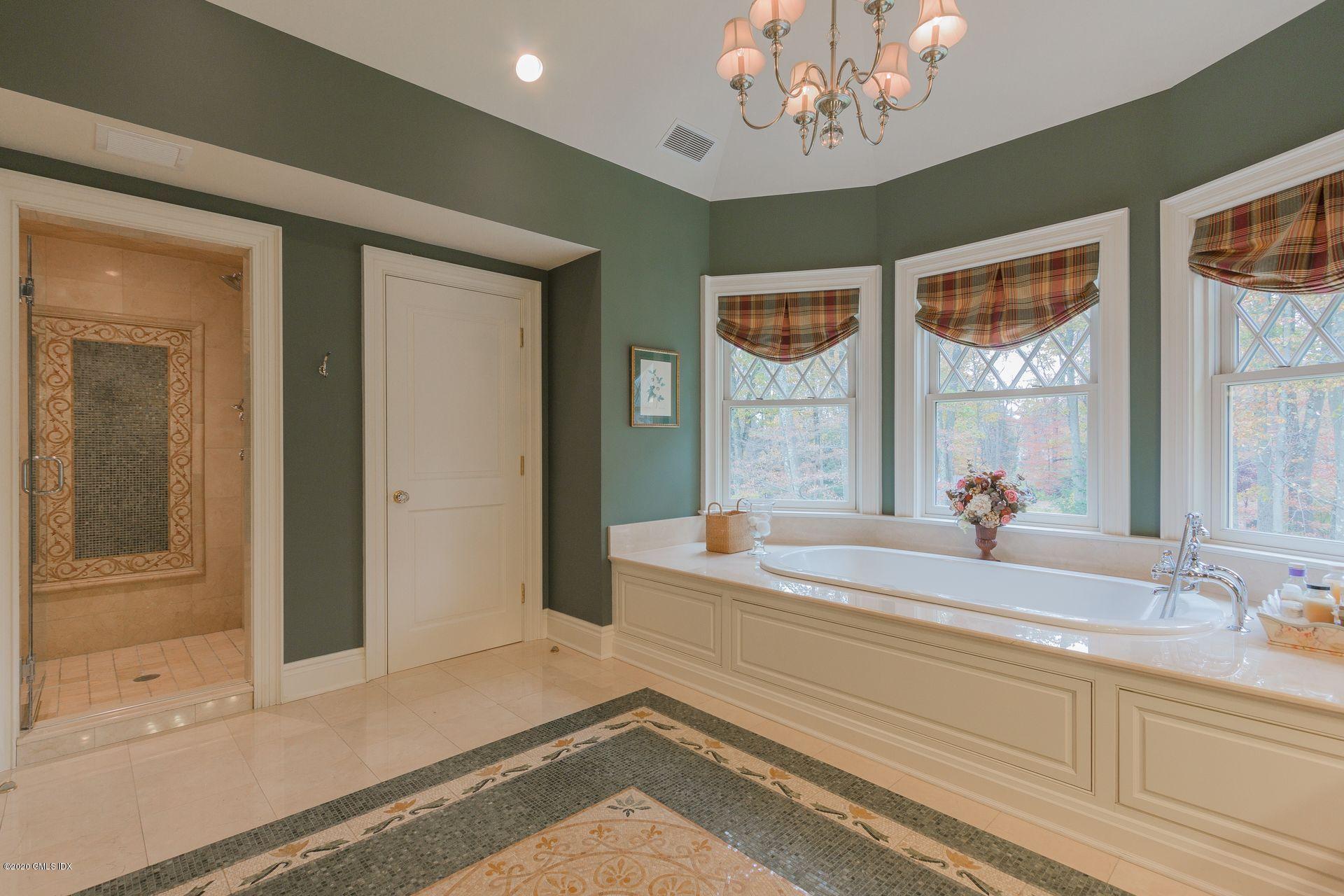 123 Kettle Creek Road Weston, CT 06883 - Photo 14 of 41 a bathroom with a tub sink and mirror
