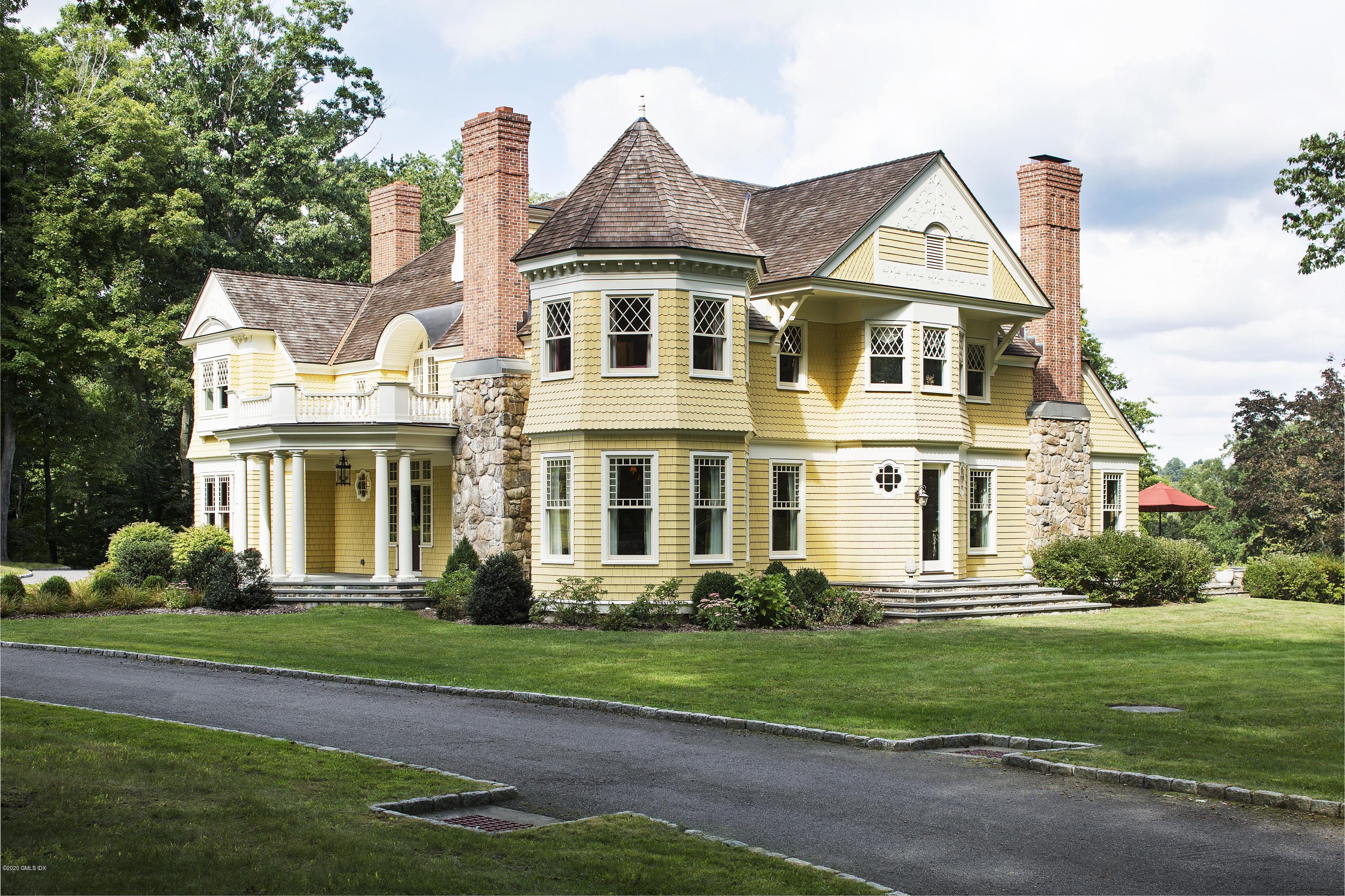 123 Kettle Creek Road Weston, CT 06883 - Photo 16 of 41 a front view of a house with a yard