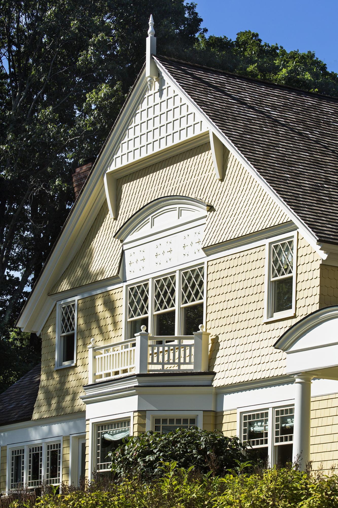 123 Kettle Creek Road Weston, CT 06883 - Photo 17 of 41 a front view of a house with a balcony