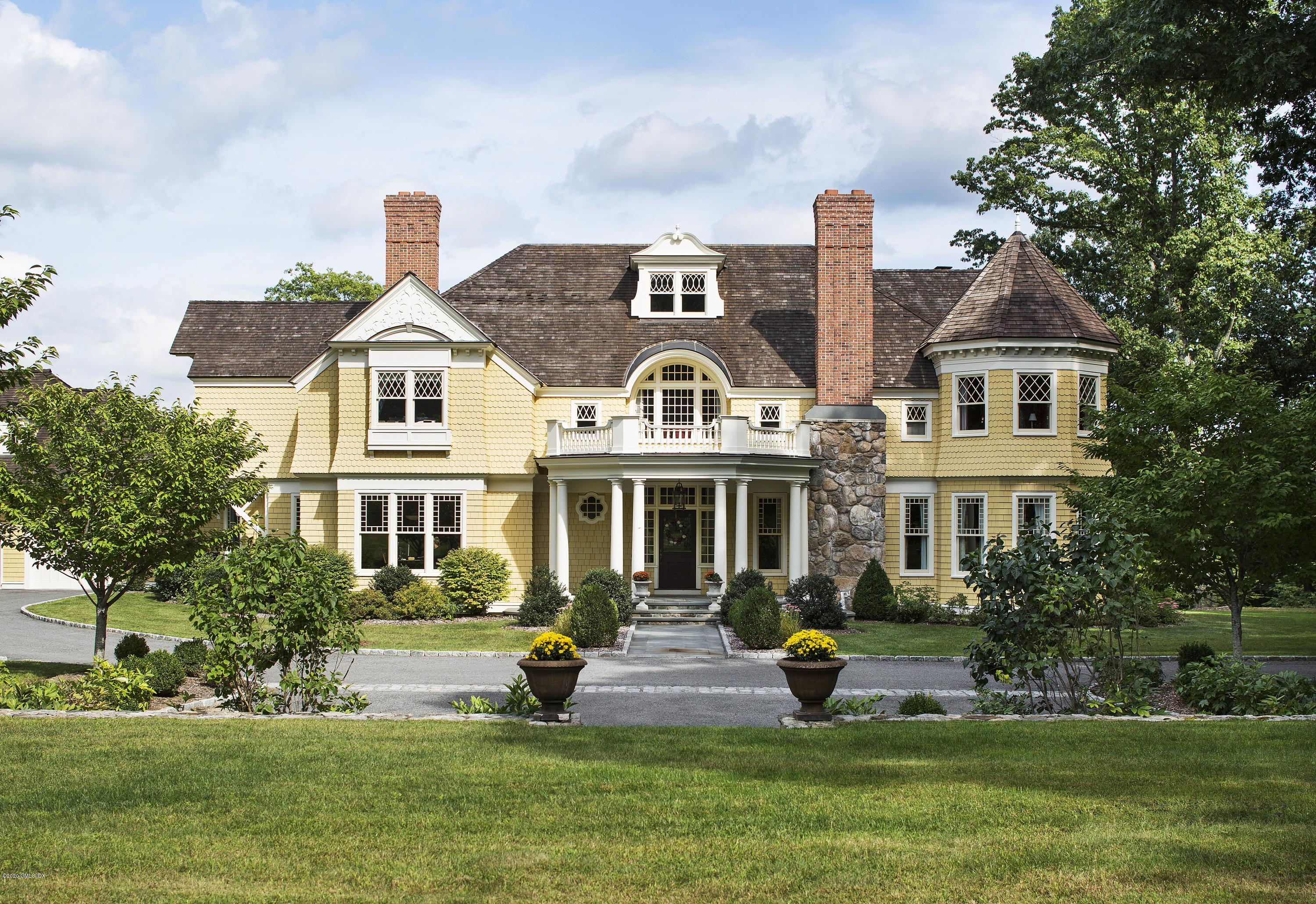 123 Kettle Creek Road Weston, CT 06883 - Photo 19 of 41 a front view of a house with a garden and plants