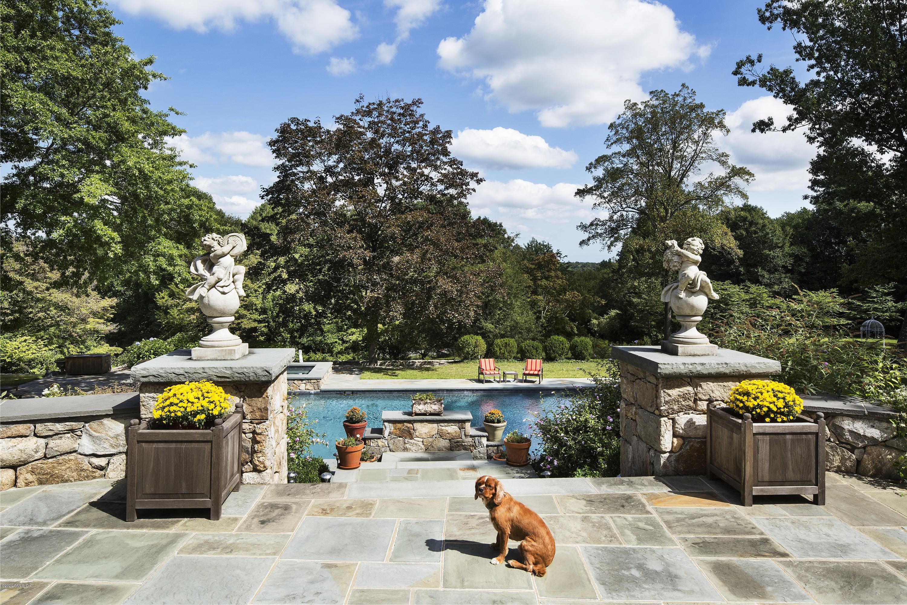 123 Kettle Creek Road Weston, CT 06883 - Photo 23 of 41 a view of a swimming pool with a patio
