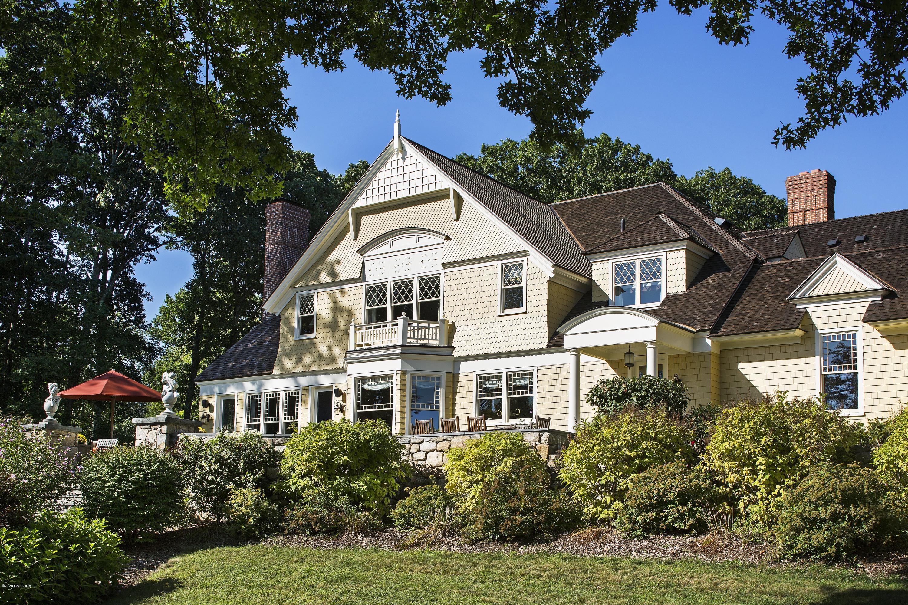 123 Kettle Creek Road Weston, CT 06883 - Photo 25 of 41 a view of a white house with a yard and potted plants