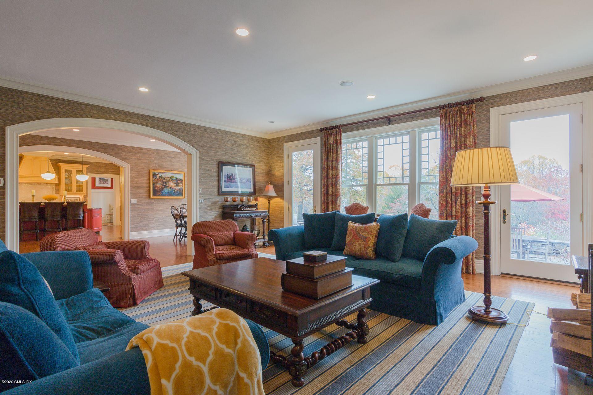 123 Kettle Creek Road Weston, CT 06883 - Photo 4 of 41 a living room with furniture a lamp and a large window