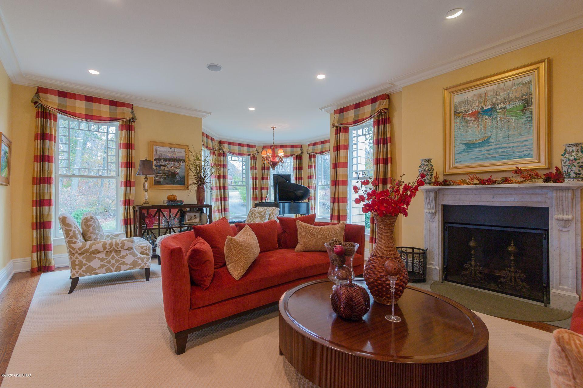 123 Kettle Creek Road Weston, CT 06883 - Photo 10 of 41 a living room with furniture and a fireplace