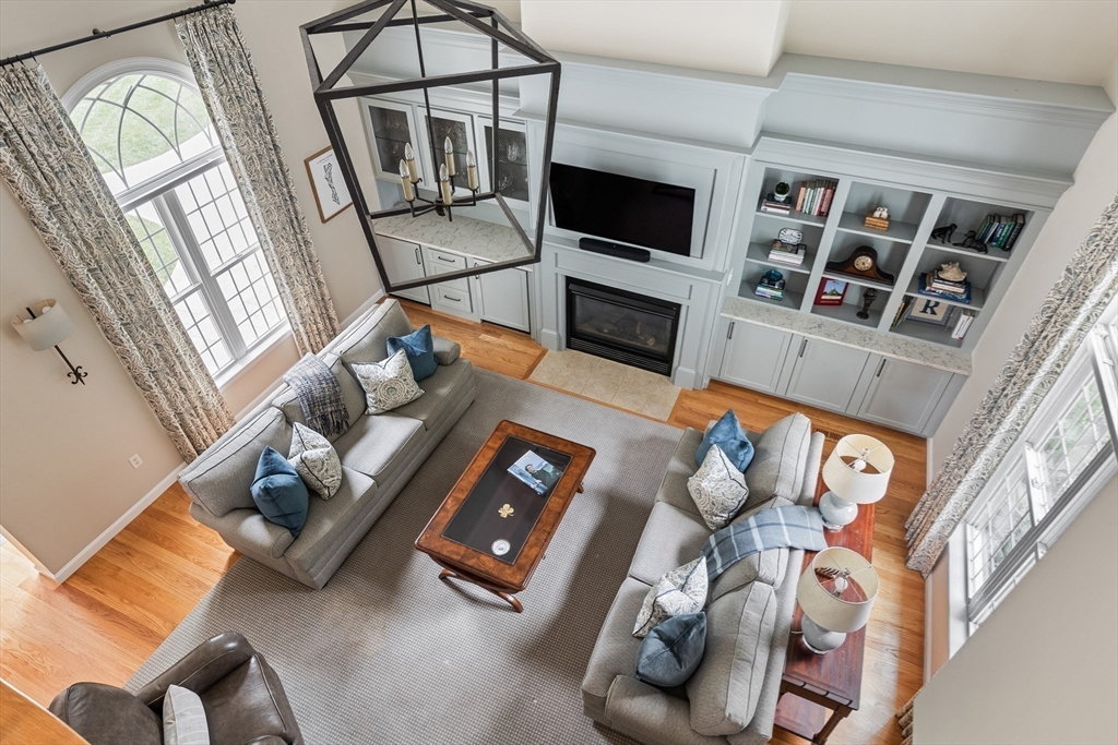 3 Bowker Road Hopkinton, MA 01748 - Photo 9 of 40 a living room with furniture and a flat screen tv