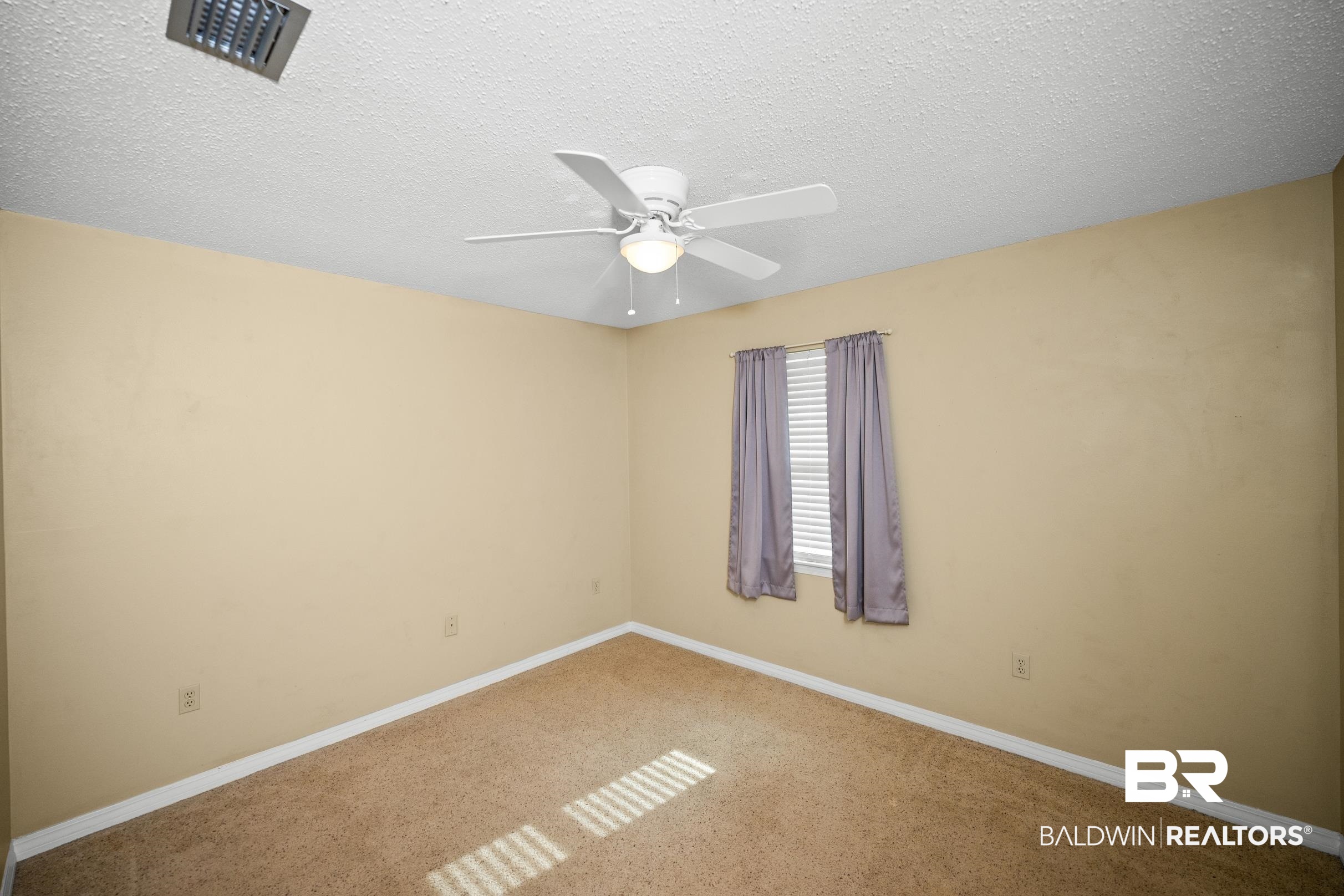 123 Dunbar Loop Daphne, AL 36526 - Photo 22 of 33 Carpeted empty room with a textured ceiling and a ceiling fan