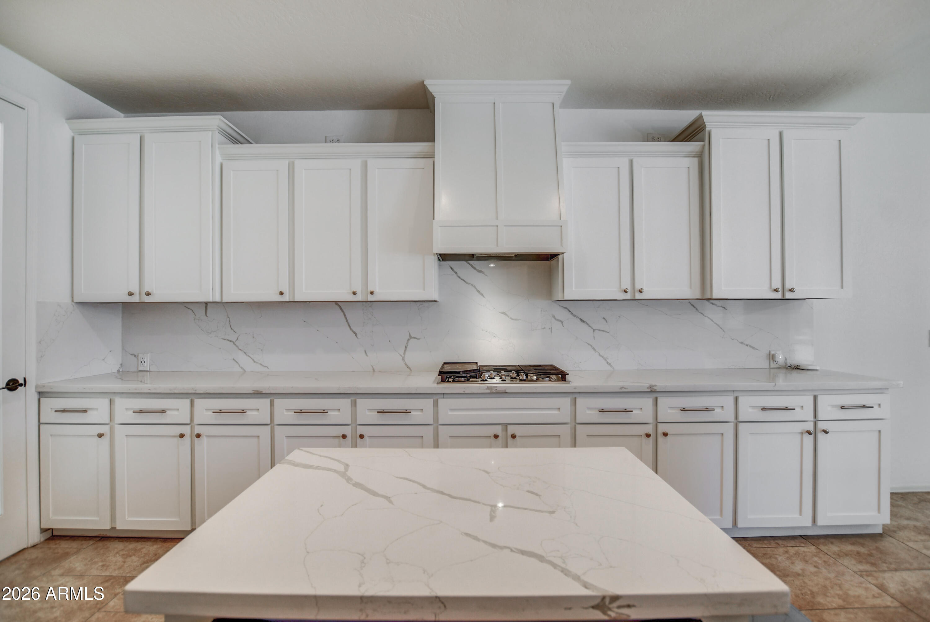 3078 East Muirfield Street Gilbert, AZ 85298 - Photo 42 of 92 a kitchen with white cabinets and white appliances