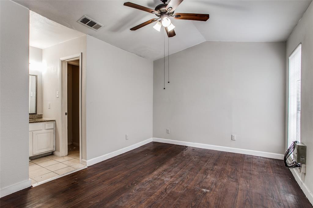 5114 Bryan Street, Unit 3 Dallas, TX 75206 - Photo 16 of 22 an empty room with wooden floor closet and windows
