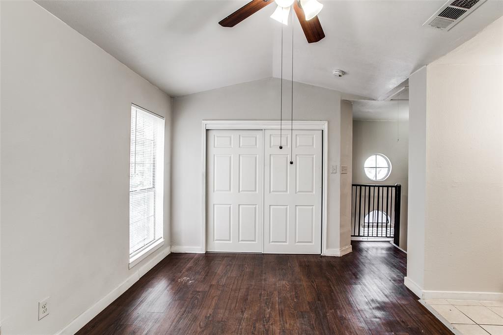 5114 Bryan Street, Unit 3 Dallas, TX 75206 - Photo 20 of 22 an empty room with wooden floor fan and windows