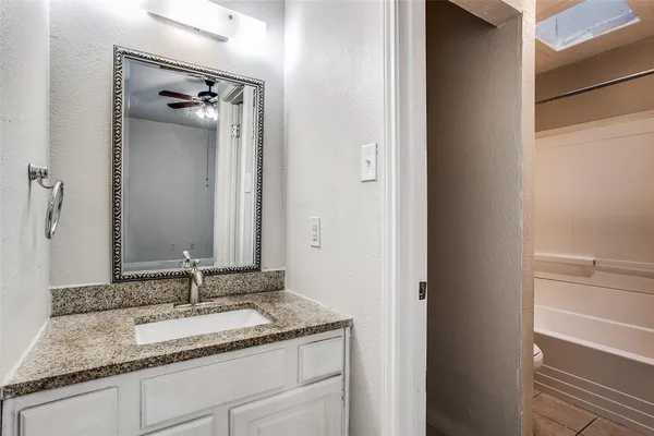 a bathroom with a shower and a toilet
