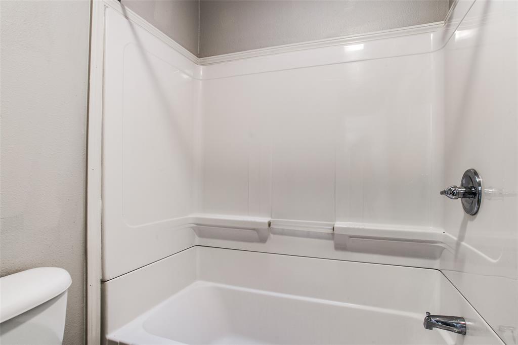 5114 Bryan Street, Unit 3 Dallas, TX 75206 - Photo 22 of 22 a bathroom with a shower and a toilet