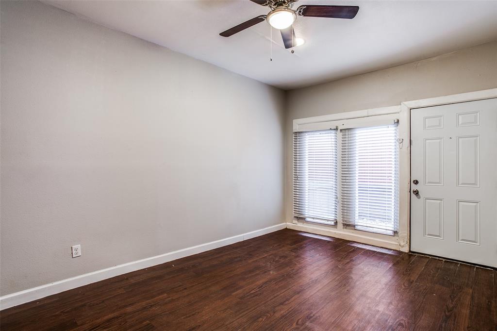 5114 Bryan Street, Unit 3 Dallas, TX 75206 - Photo 8 of 22 an empty room with wooden floor and windows