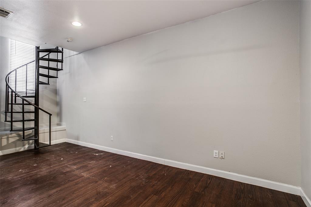 5114 Bryan Street, Unit 3 Dallas, TX 75206 - Photo 10 of 22 wooden floor in an empty room with stairs